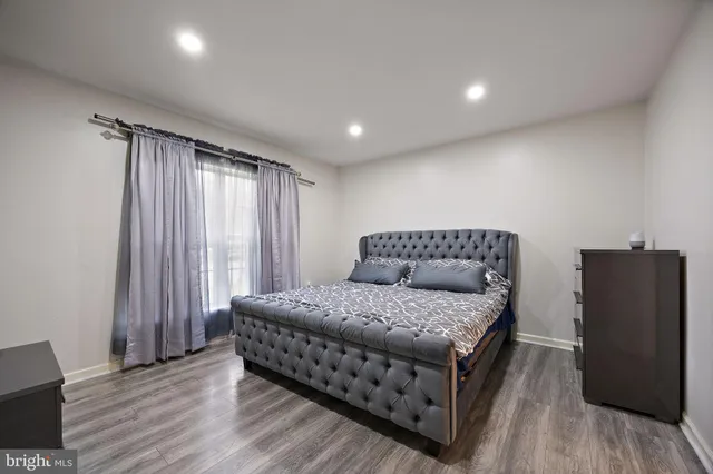 a room with a bed and a mirror