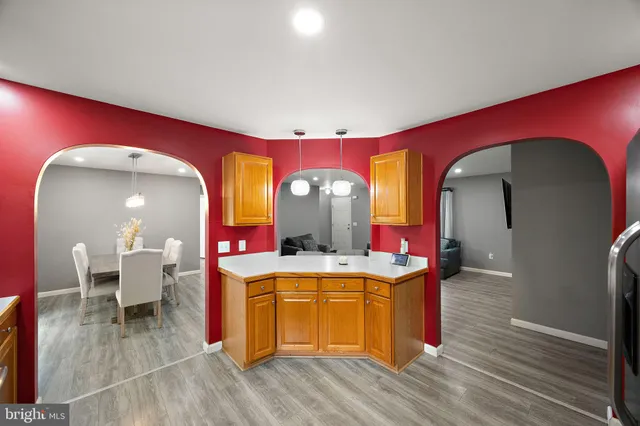 a living room with fireplace furniture and a wooden floor