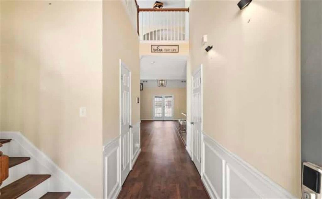2162 Capella Circle Southwest Atlanta, GA 30331 - Photo 2 of 11 a view of a hallway with wooden floor and staircase