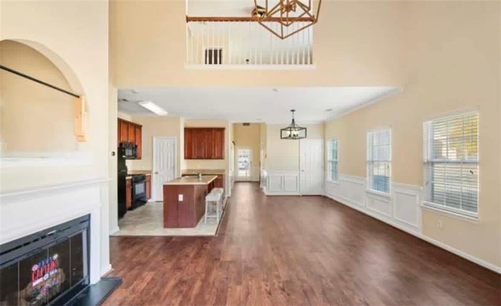 2162 Capella Circle Southwest Atlanta, GA 30331 - Photo 6 of 11 a view of a living room with furniture a fireplace and wooden floor