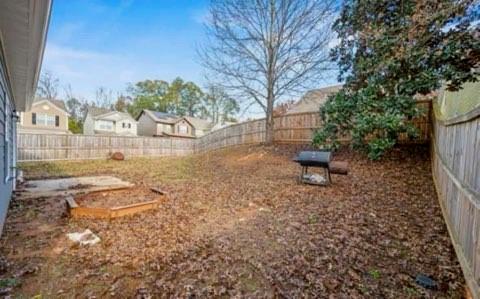 2162 Capella Circle Southwest Atlanta, GA 30331 - Photo 10 of 11 a backyard of a house with lots of green space