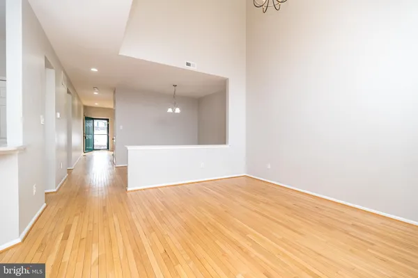 a kitchen with stainless steel appliances granite countertop a refrigerator microwave and sink