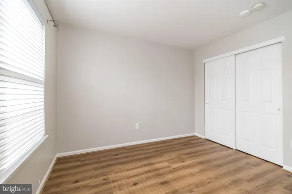 a bathroom with a sink a toilet and shower curtain