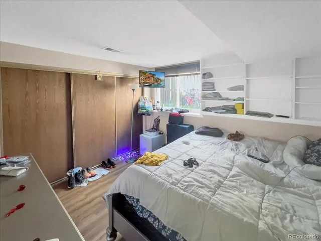 a bed room with a bed and a table