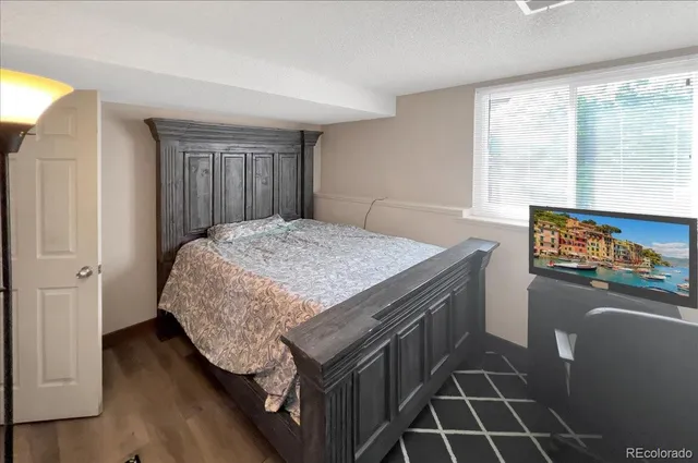 a kitchen with granite countertop a stove and a refrigerator