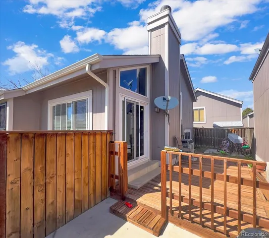 a view of a chair and table in the balcony