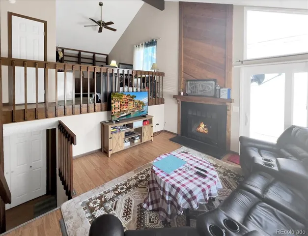a bedroom with furniture and a book shelf