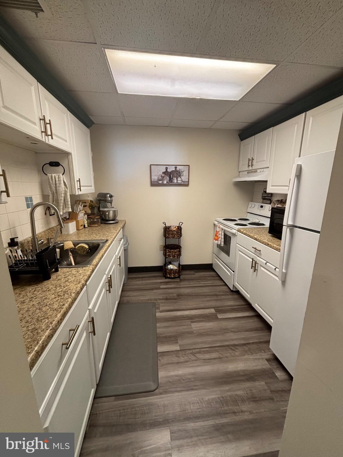 145 Main Street, Unit C Pennsburg, PA 18073 - Photo 2 of 7 a kitchen with stainless steel appliances granite countertop a sink stove and refrigerator