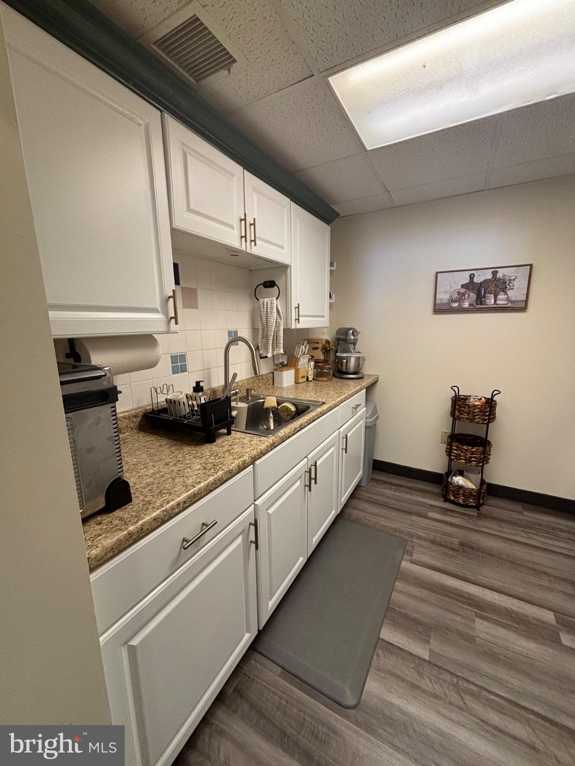 145 Main Street, Unit C Pennsburg, PA 18073 - Photo 3 of 7 a kitchen with stainless steel appliances a sink stove and cabinets