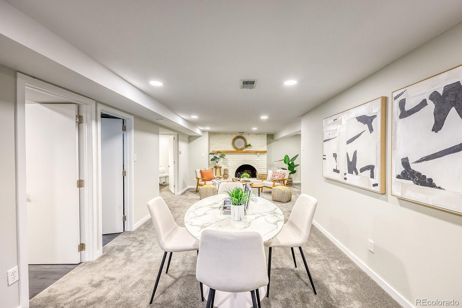 2785 South Hazel Court Denver, CO 80236 - Photo 22 of 38 a view of a dining room with furniture window and outside view