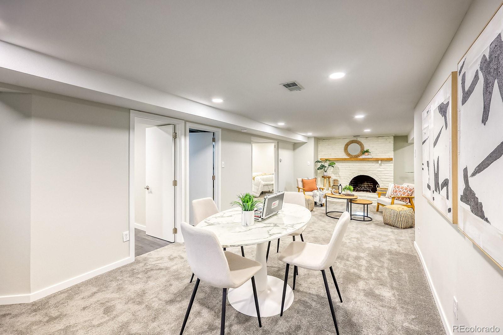 2785 South Hazel Court Denver, CO 80236 - Photo 23 of 38 a view of a dining room with furniture window and outside view