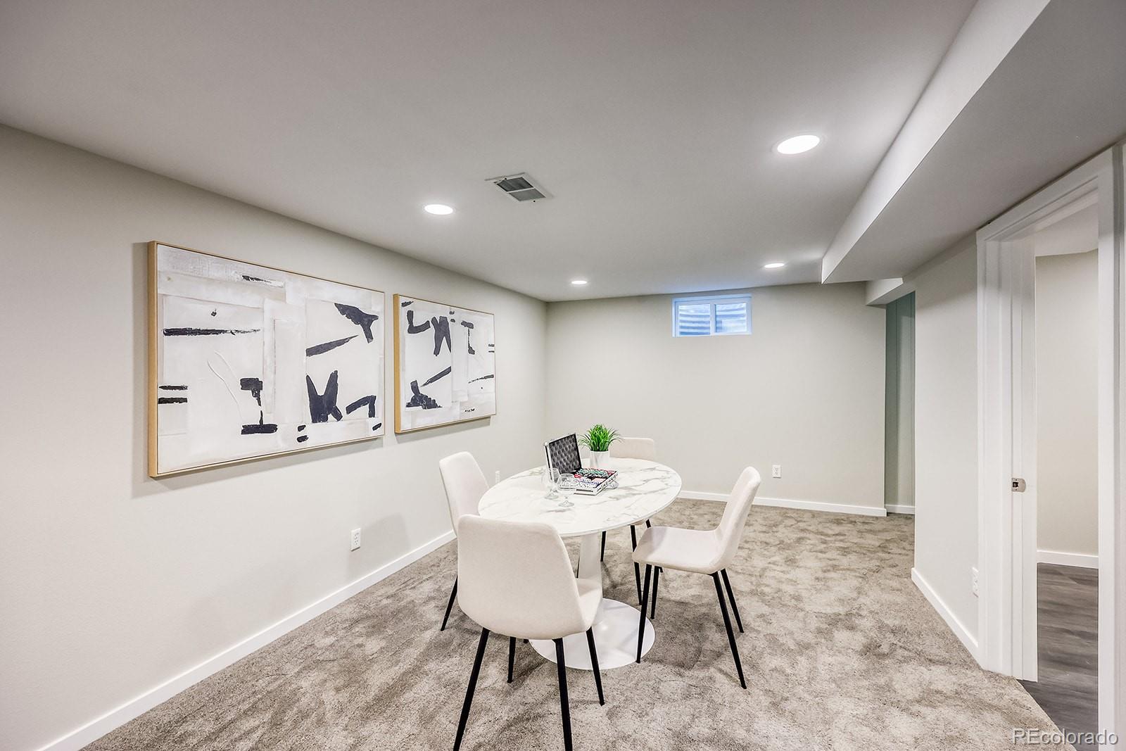 2785 South Hazel Court Denver, CO 80236 - Photo 31 of 38 a view of a dining room with furniture and wooden floor