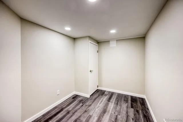 a view of room with wooden floor