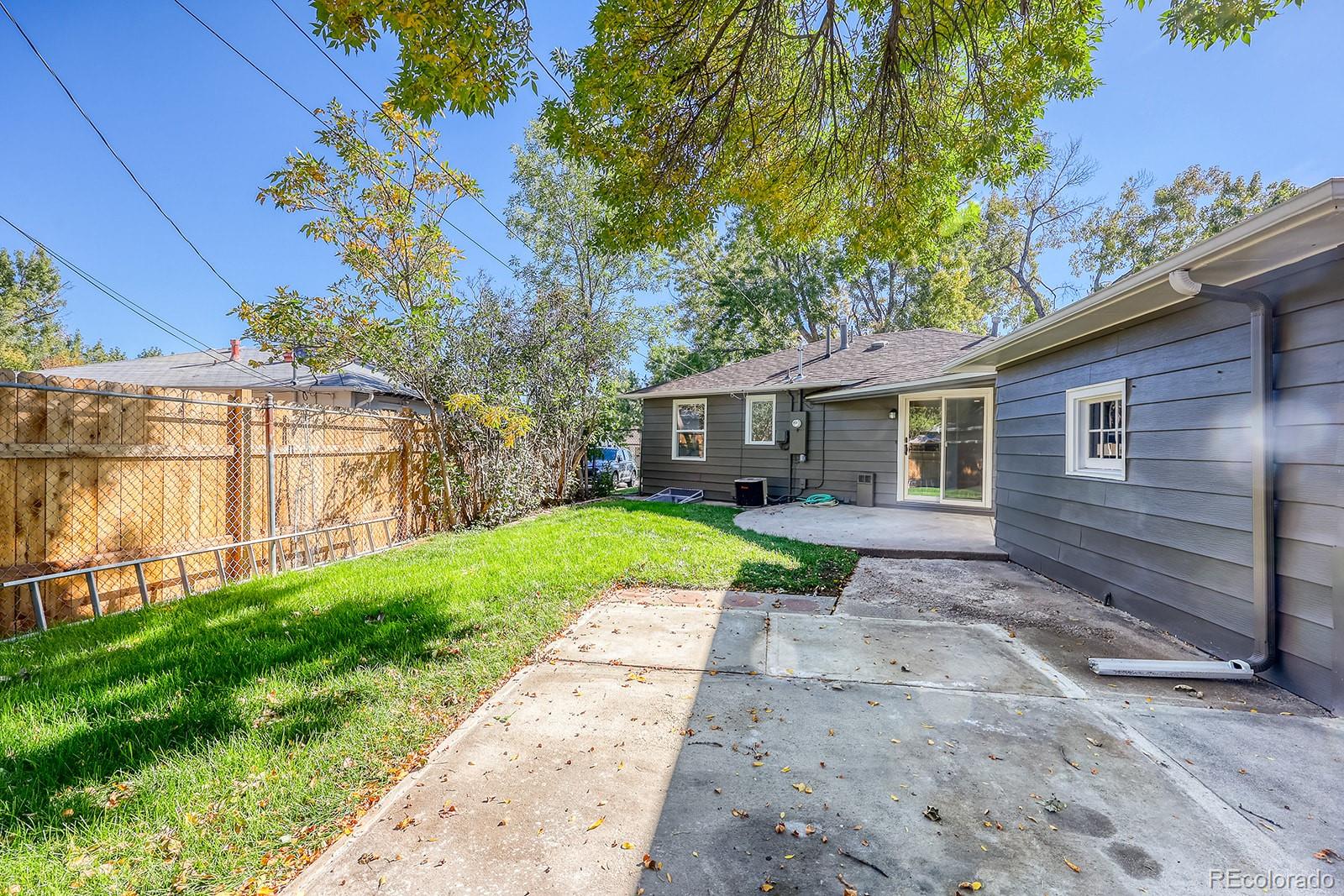 2785 South Hazel Court Denver, CO 80236 - Photo 37 of 38 a front view of house with yard and green space