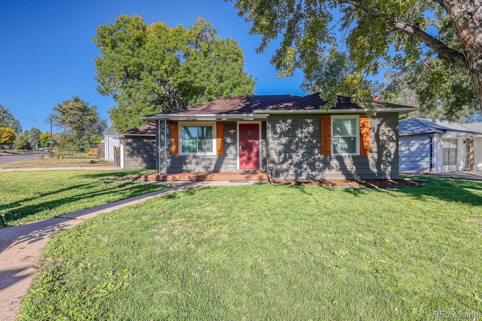 2785 South Hazel Court Denver, CO 80236 - Photo 38 of 38 a view of a house with a yard porch and sitting area