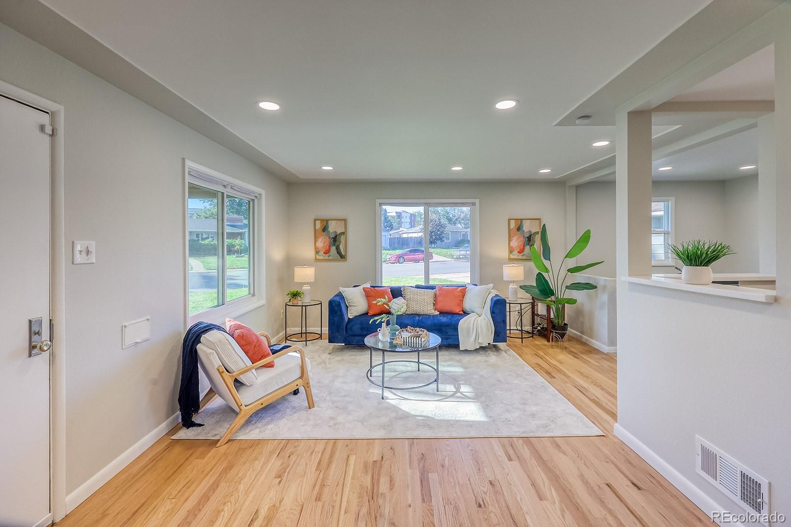 2785 South Hazel Court Denver, CO 80236 - Photo 5 of 38 a living room with furniture and wooden floor