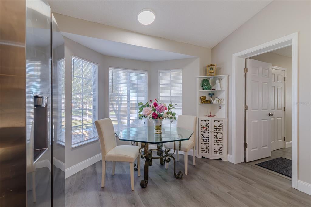 5334 Northwest 19th Place Ocala, FL 34482 - Photo 11 of 42 a dining room with furniture and wooden floor