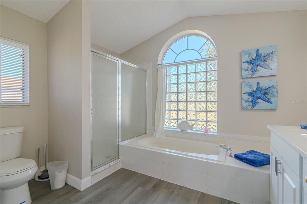 5334 Northwest 19th Place Ocala, FL 34482 - Photo 14 of 42 a bathroom with a bathtub and a toilet