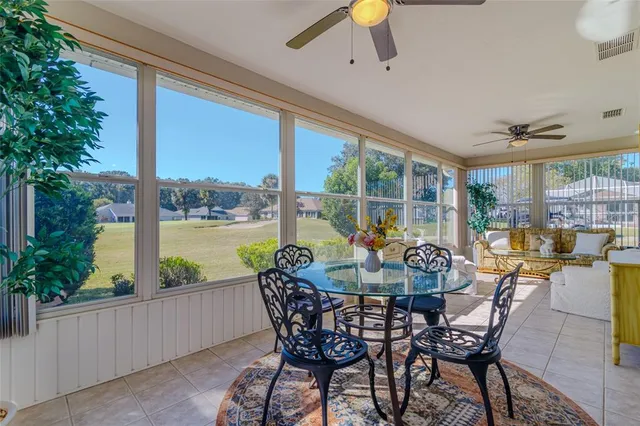 a view of an outdoor space with furniture and garden view