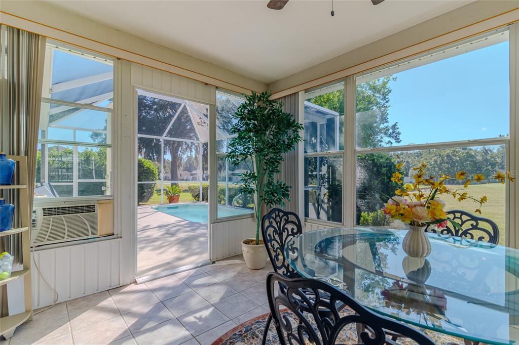 5334 Northwest 19th Place Ocala, FL 34482 - Photo 20 of 42 a view of a dining room with furniture window and outside view
