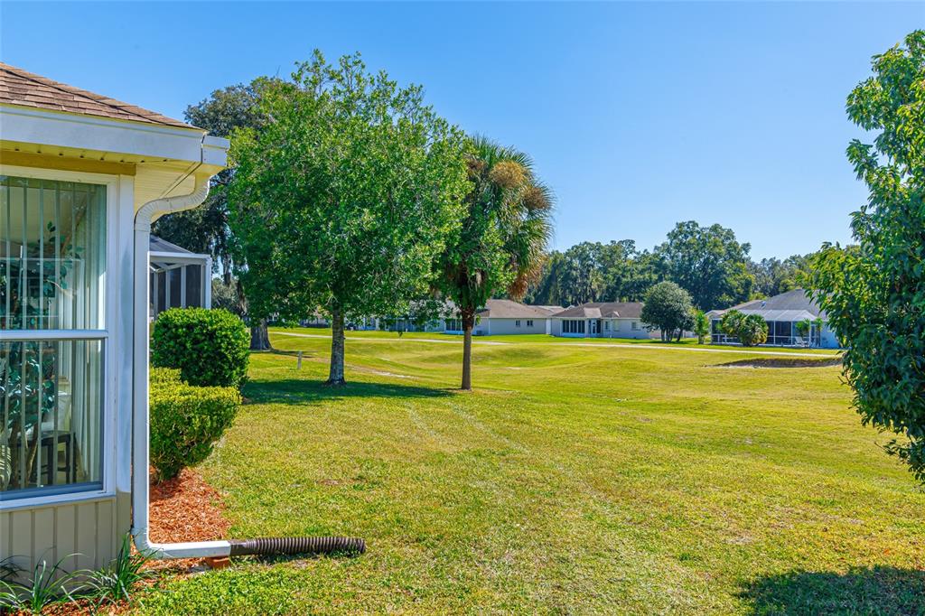 5334 Northwest 19th Place Ocala, FL 34482 - Photo 25 of 42 a view of a swimming pool with an outdoor space and seating area