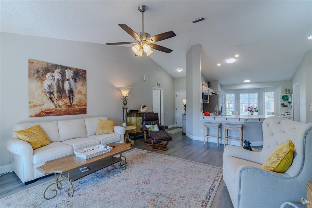 5334 Northwest 19th Place Ocala, FL 34482 - Photo 3 of 42 a living room with furniture and a chandelier