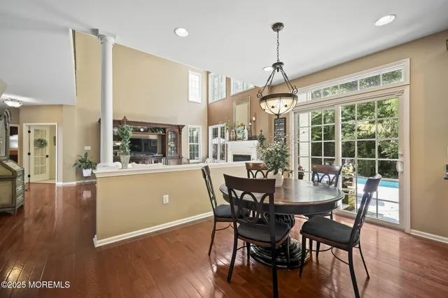 a bathroom with a granite countertop sink a toilet and a mirror