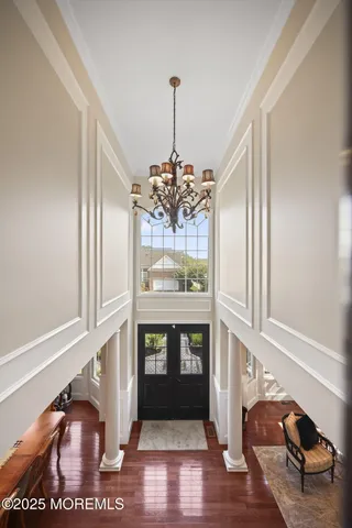 a view of a patio with dining table and chairs with wooden fence