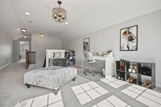 a view of a patio with a table and chairs under an umbrella
