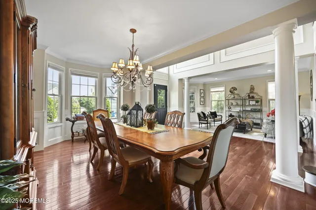 a living room with furniture large window and a fireplace