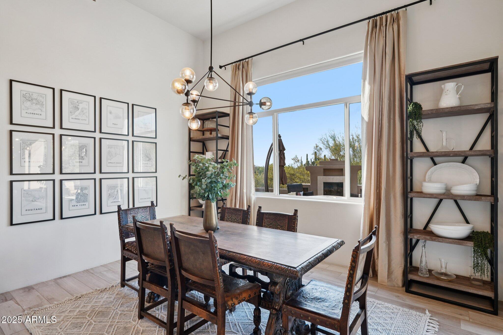 30600 North Pima Road, Unit 49 Scottsdale, AZ 85266 - Photo 14 of 53 a view of a dining room with furniture window and wooden floor