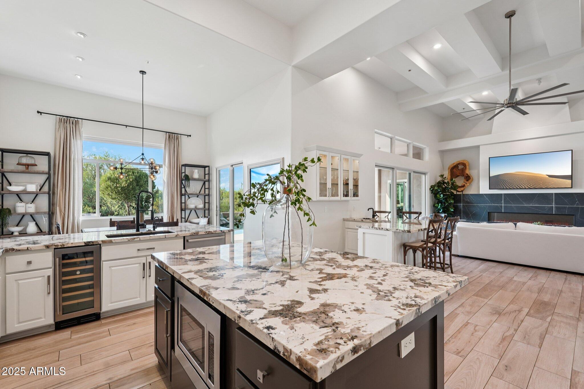 30600 North Pima Road, Unit 49 Scottsdale, AZ 85266 - Photo 16 of 53 a kitchen with center island and stainless steel appliances