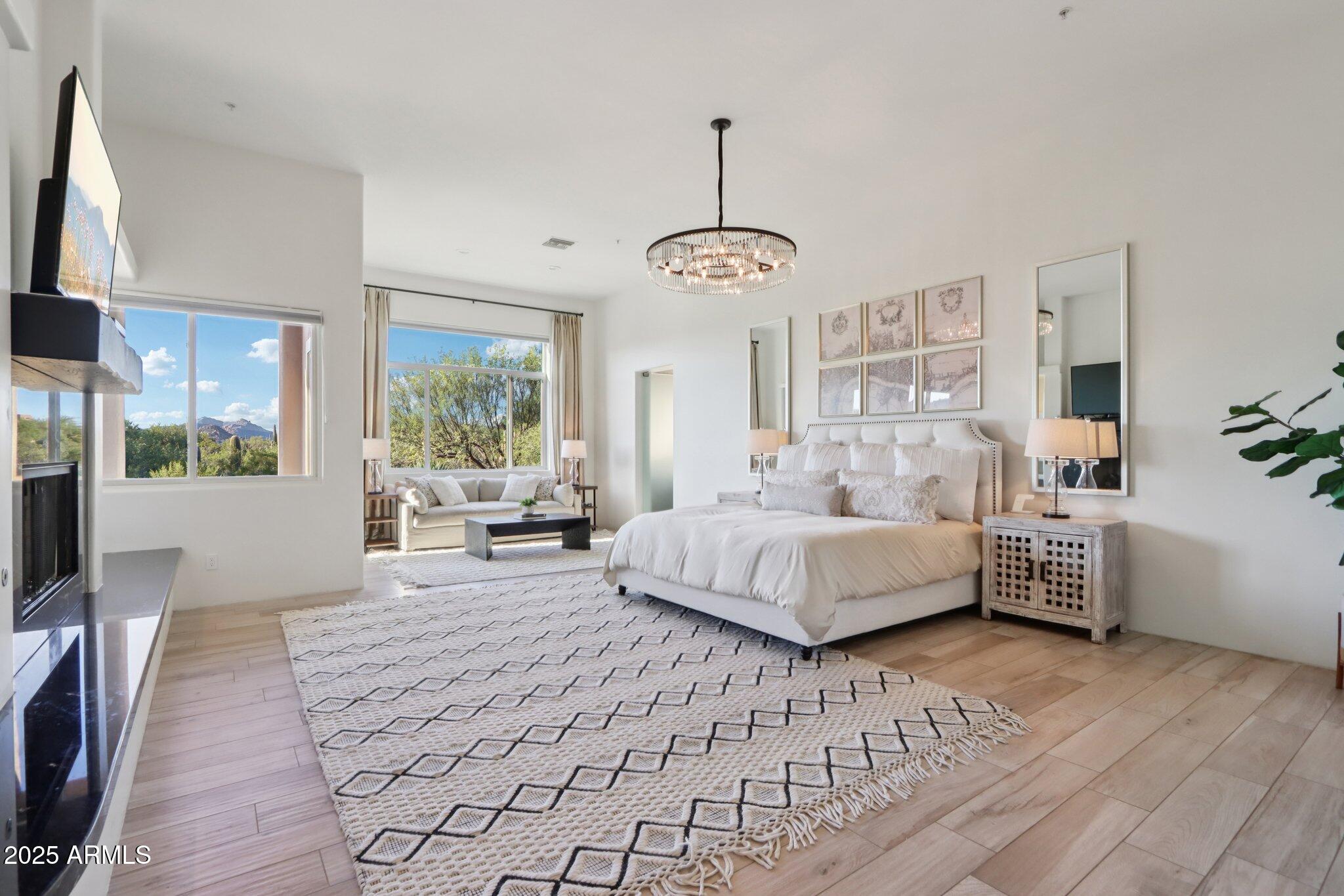 30600 North Pima Road, Unit 49 Scottsdale, AZ 85266 - Photo 17 of 53 a spacious bedroom with a large bed and a window