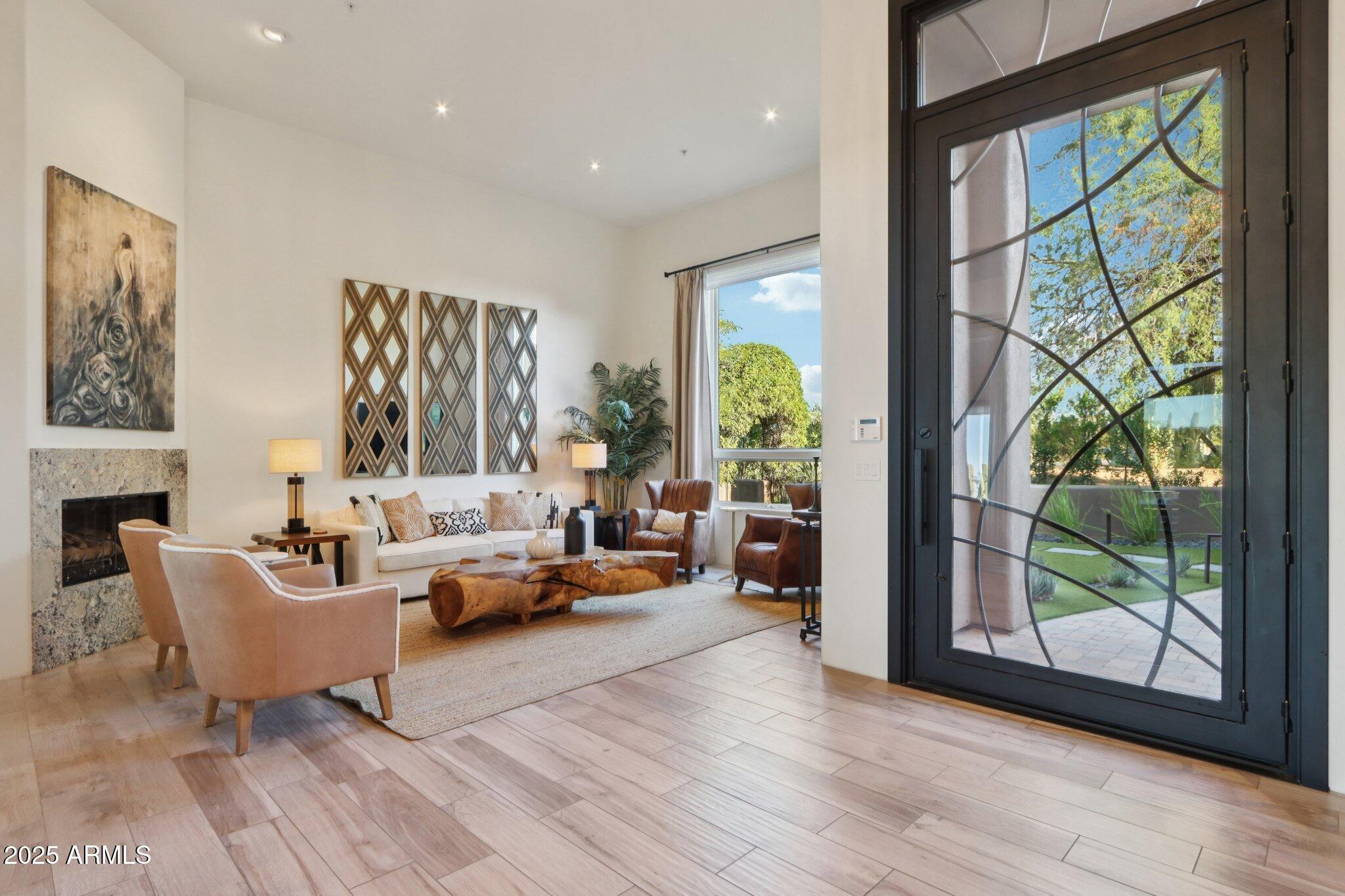 30600 North Pima Road, Unit 49 Scottsdale, AZ 85266 - Photo 2 of 53 a living room with furniture and a large window