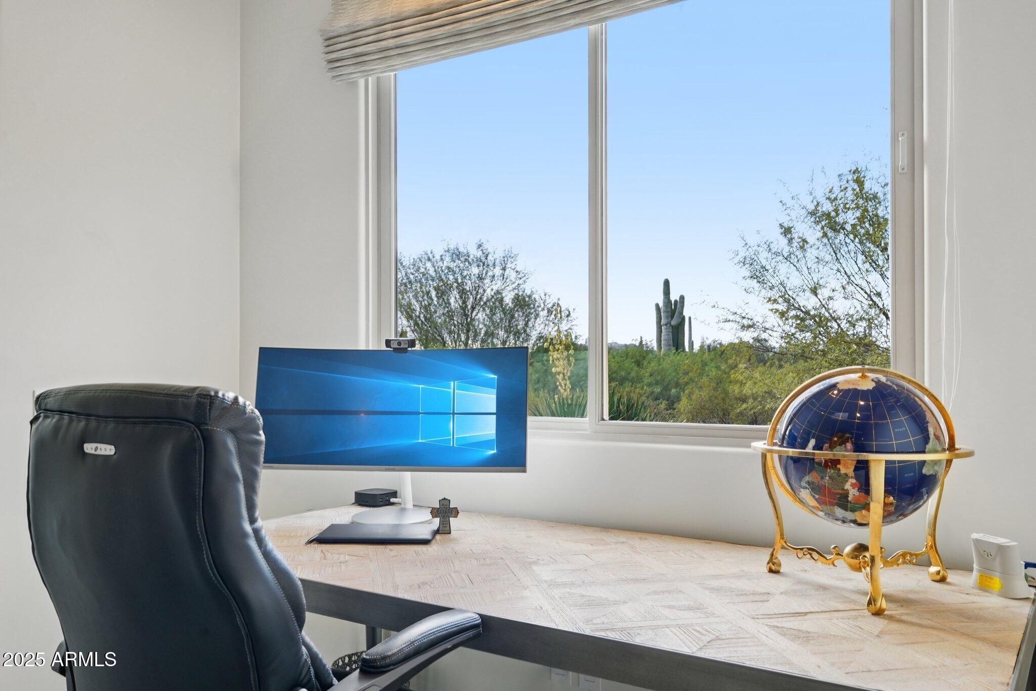 30600 North Pima Road, Unit 49 Scottsdale, AZ 85266 - Photo 25 of 53 a room with a table and a chair