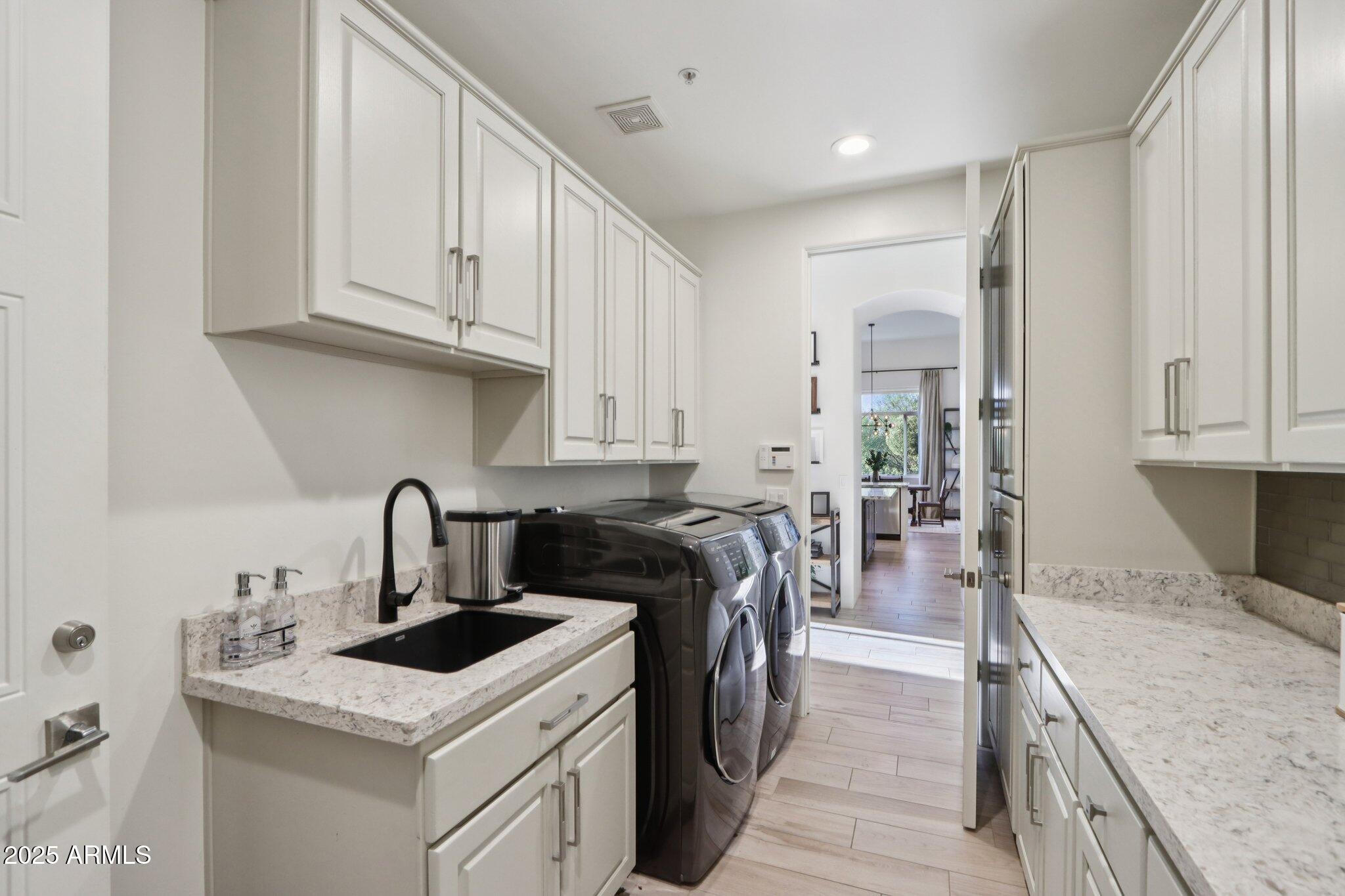 30600 North Pima Road, Unit 49 Scottsdale, AZ 85266 - Photo 27 of 53 a kitchen with a sink stove and cabinets