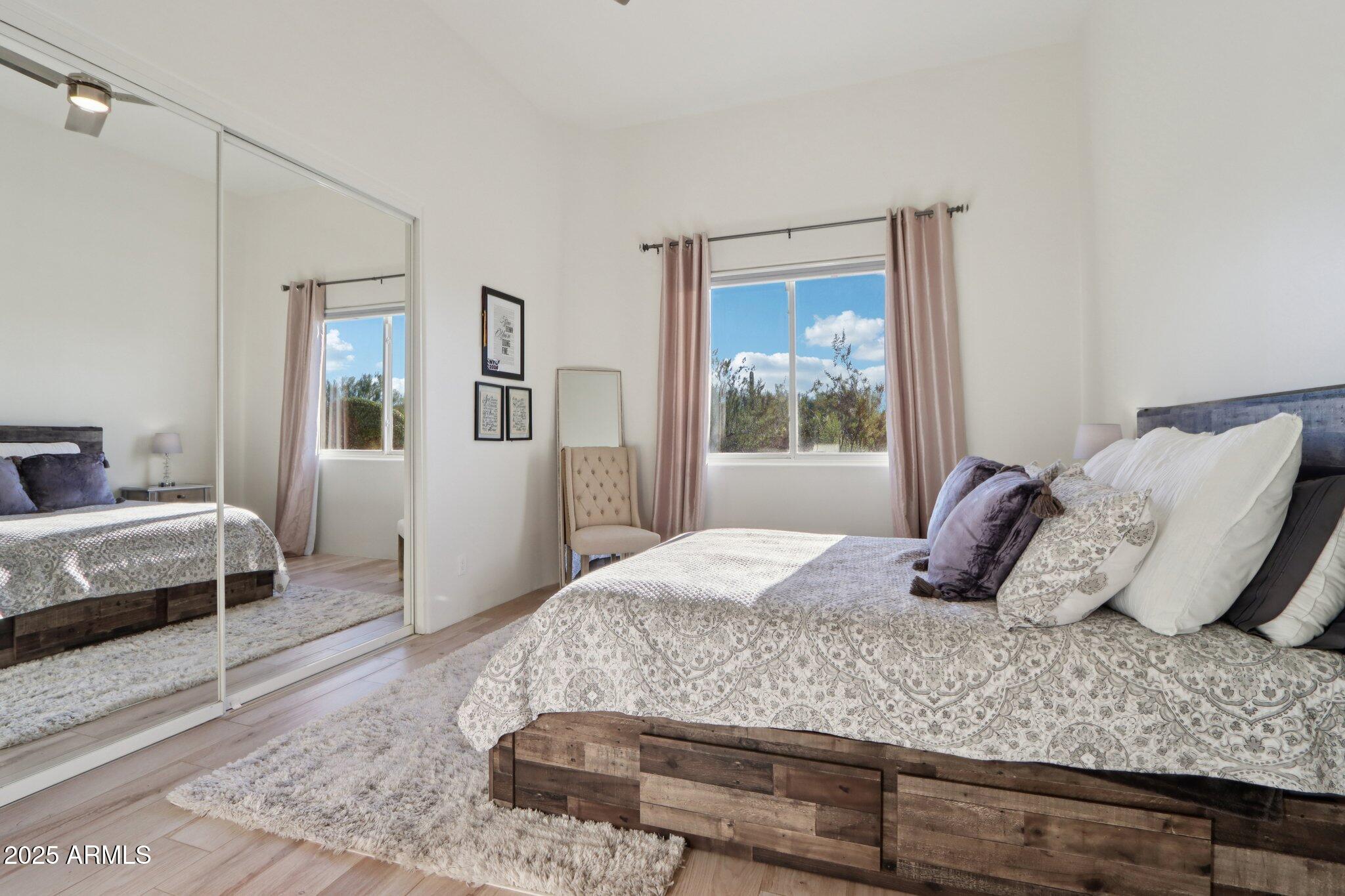 30600 North Pima Road, Unit 49 Scottsdale, AZ 85266 - Photo 28 of 53 a bedroom with a large bed and a window