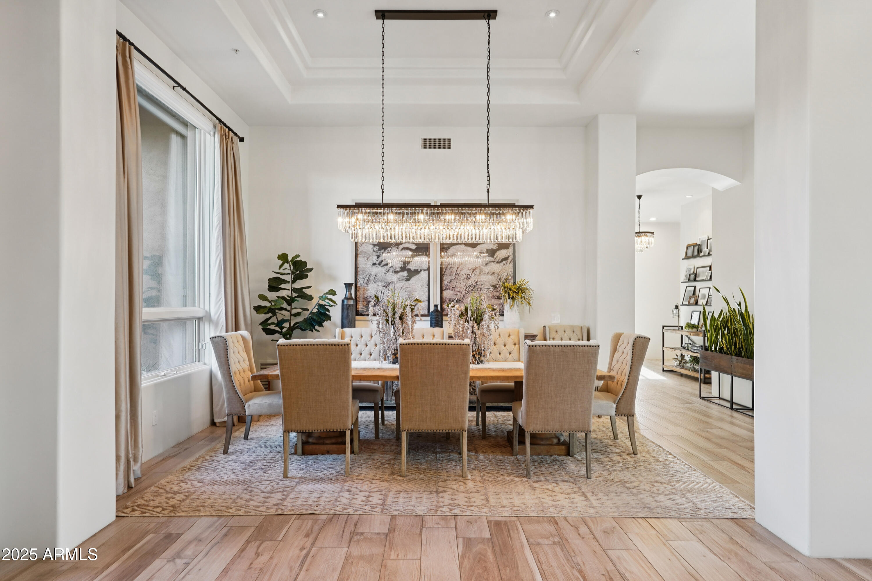 30600 North Pima Road, Unit 49 Scottsdale, AZ 85266 - Photo 3 of 53 a dining room with furniture a chandelier and wooden floor