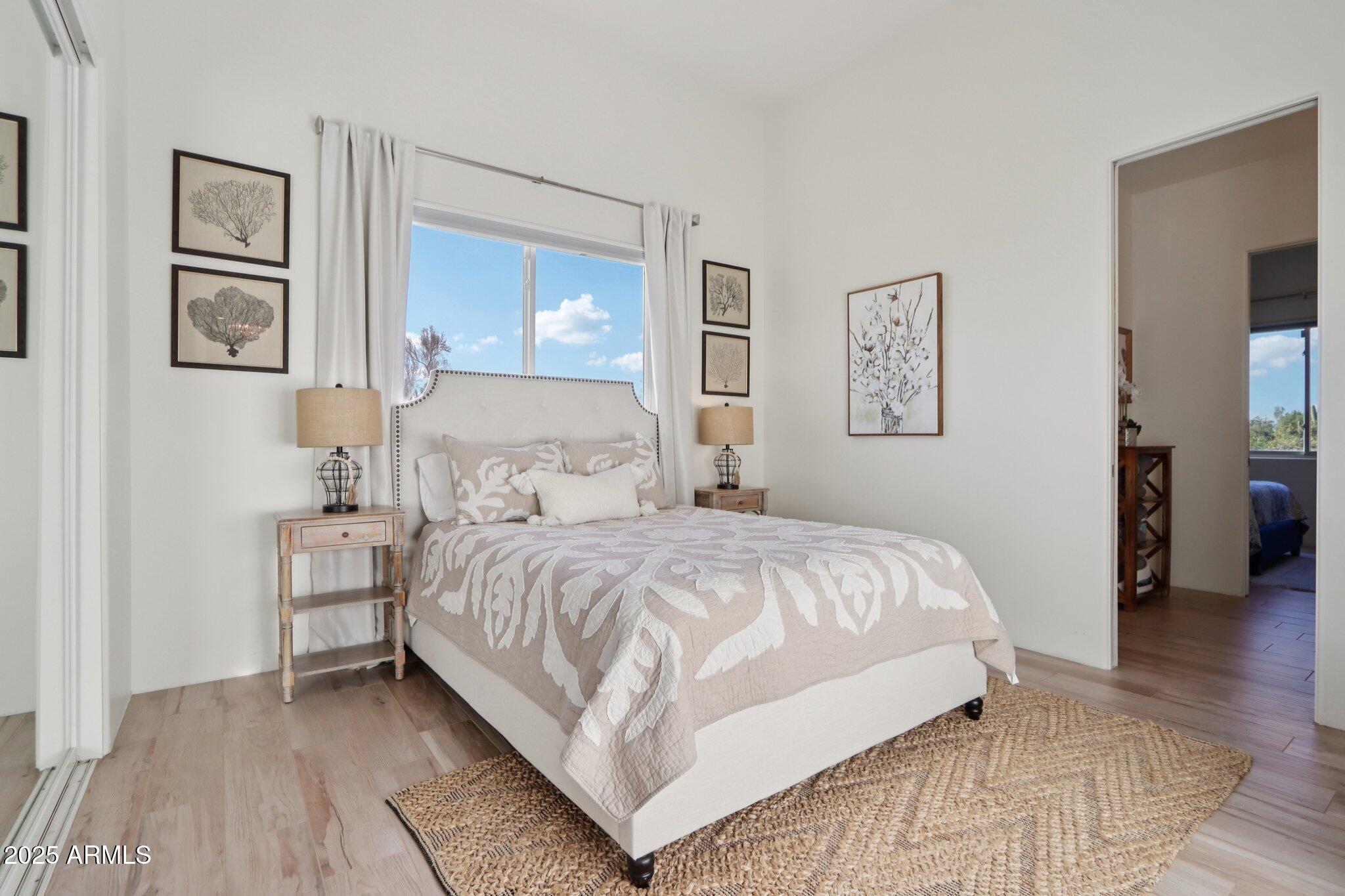 30600 North Pima Road, Unit 49 Scottsdale, AZ 85266 - Photo 30 of 53 a bedroom with a bed and painting on the wall