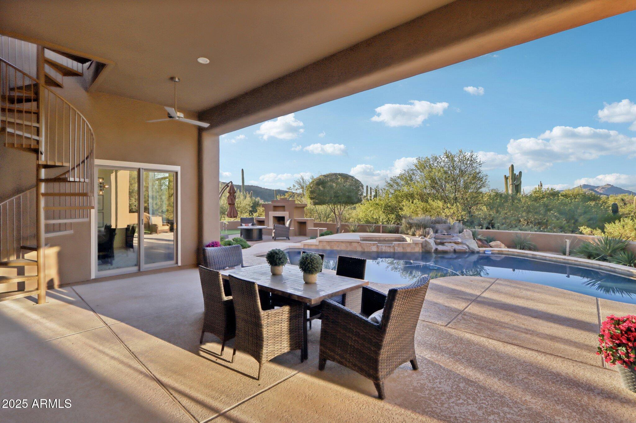 30600 North Pima Road, Unit 49 Scottsdale, AZ 85266 - Photo 33 of 53 a view of a patio with couches table and chairs