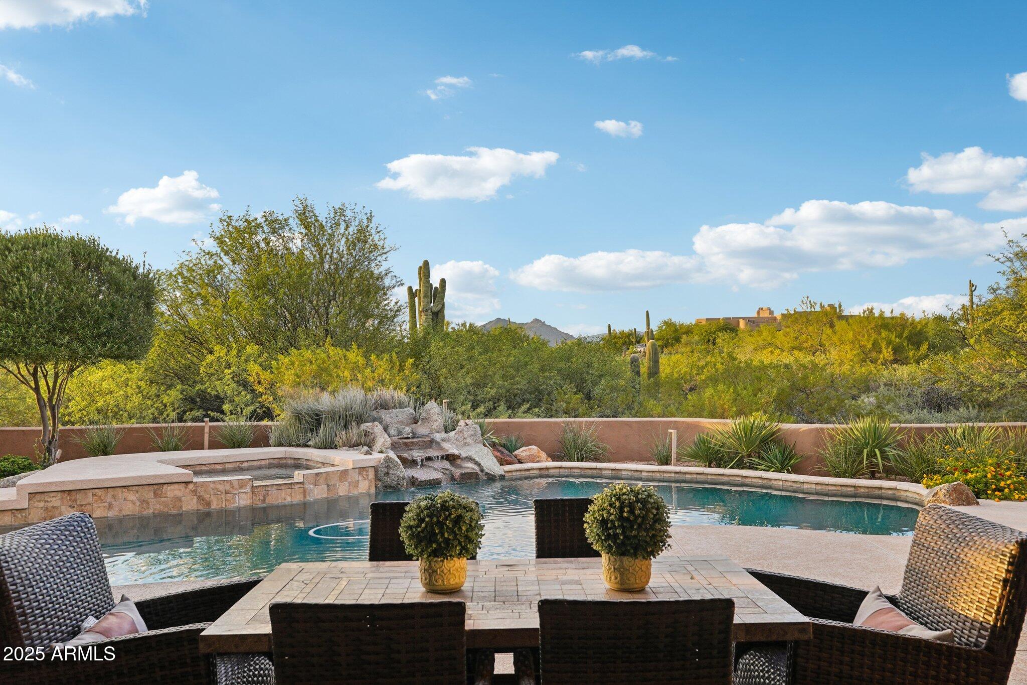 30600 North Pima Road, Unit 49 Scottsdale, AZ 85266 - Photo 34 of 53 a view of a balcony with table and chairs