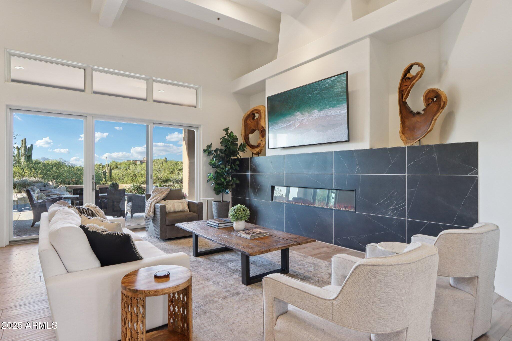 30600 North Pima Road, Unit 49 Scottsdale, AZ 85266 - Photo 4 of 53 a living room with furniture and a large window