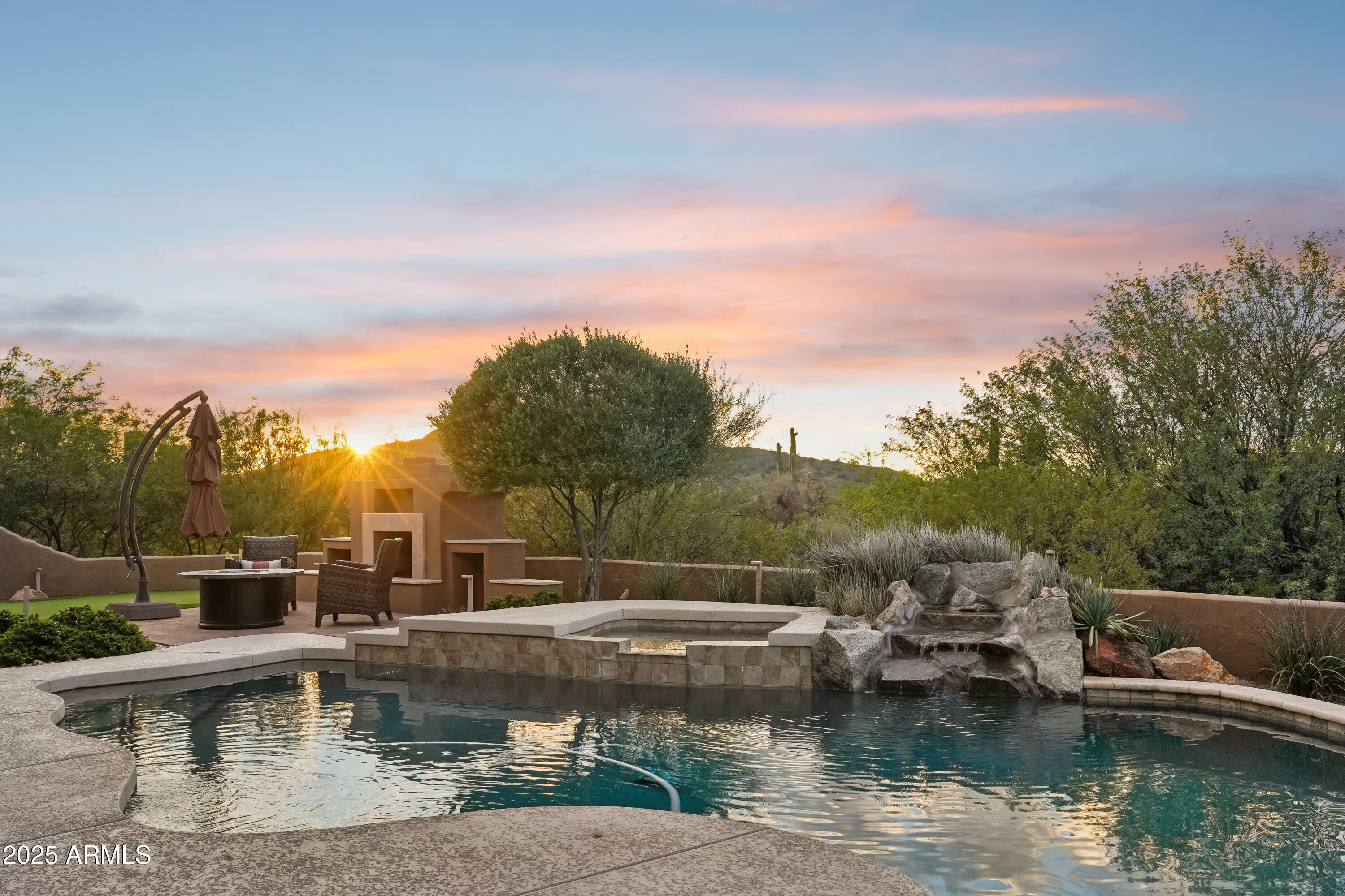 30600 North Pima Road, Unit 49 Scottsdale, AZ 85266 - Photo 44 of 53 a view of a lake with a house in the background