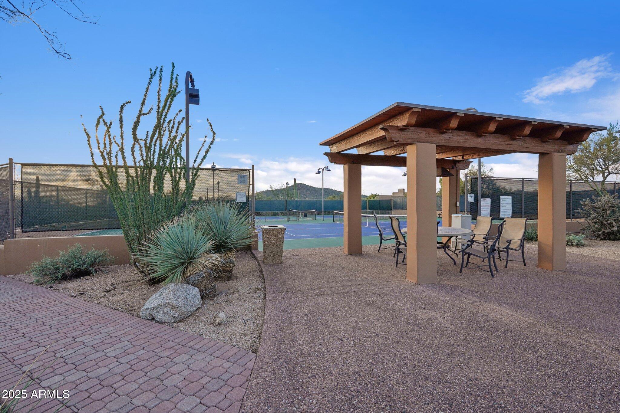 30600 North Pima Road, Unit 49 Scottsdale, AZ 85266 - Photo 50 of 53 a view of a chairs and table in the patio