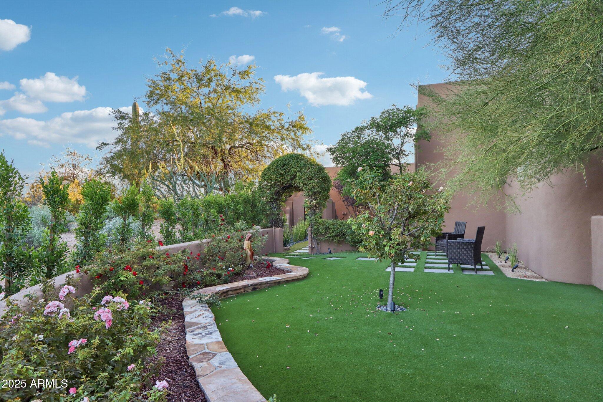 30600 North Pima Road, Unit 49 Scottsdale, AZ 85266 - Photo 7 of 53 a view of a garden with a fountain