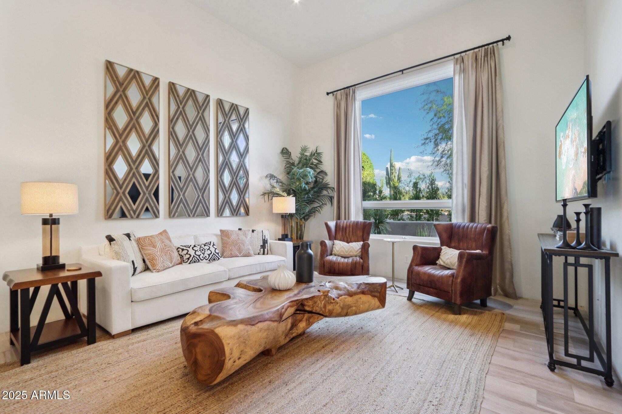 30600 North Pima Road, Unit 49 Scottsdale, AZ 85266 - Photo 10 of 53 a living room with furniture and a flat screen tv