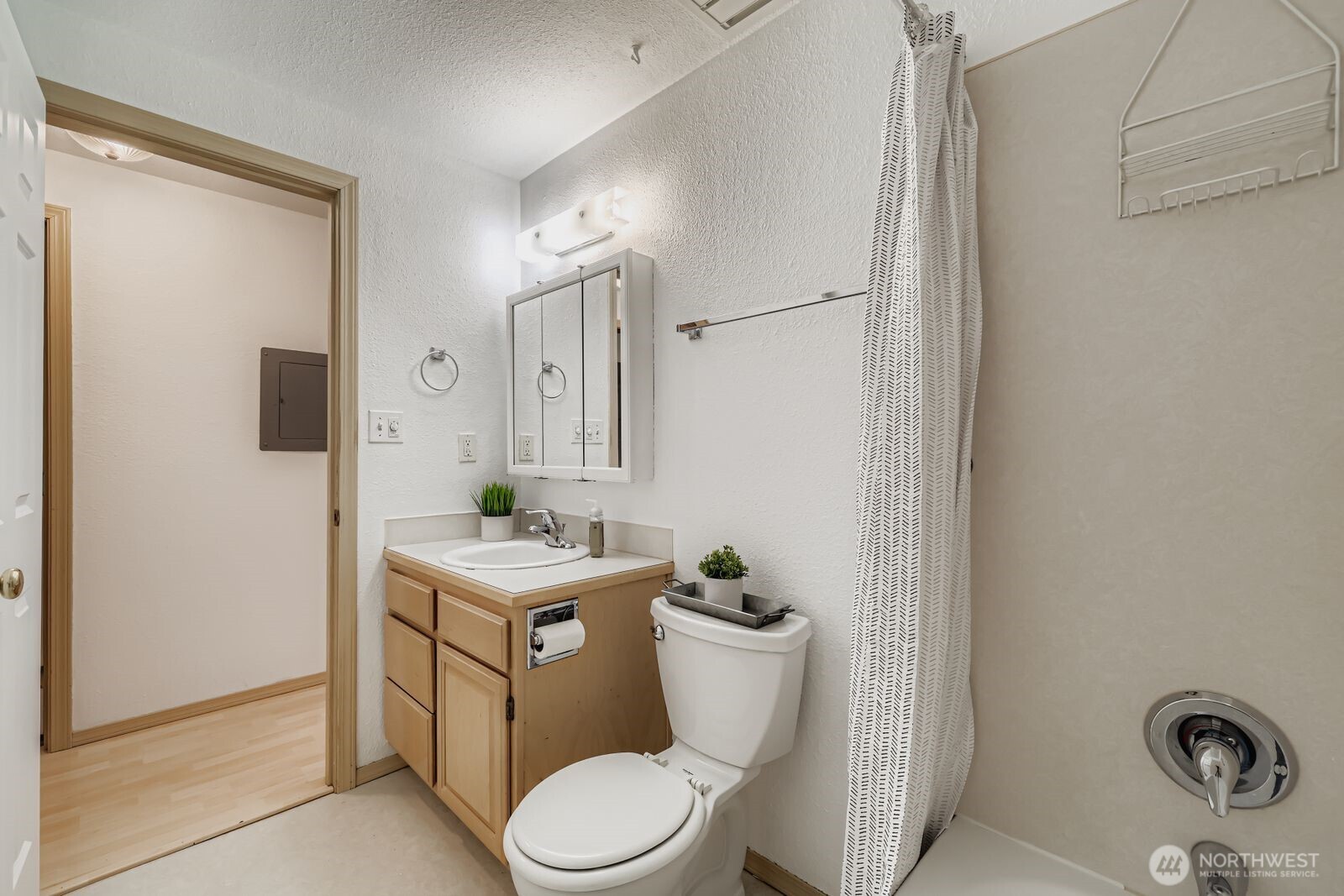 2120 Highland Avenue, Unit 104 Everett, WA 98201 - Photo 15 of 22 a bathroom with a toilet a sink and a mirror
