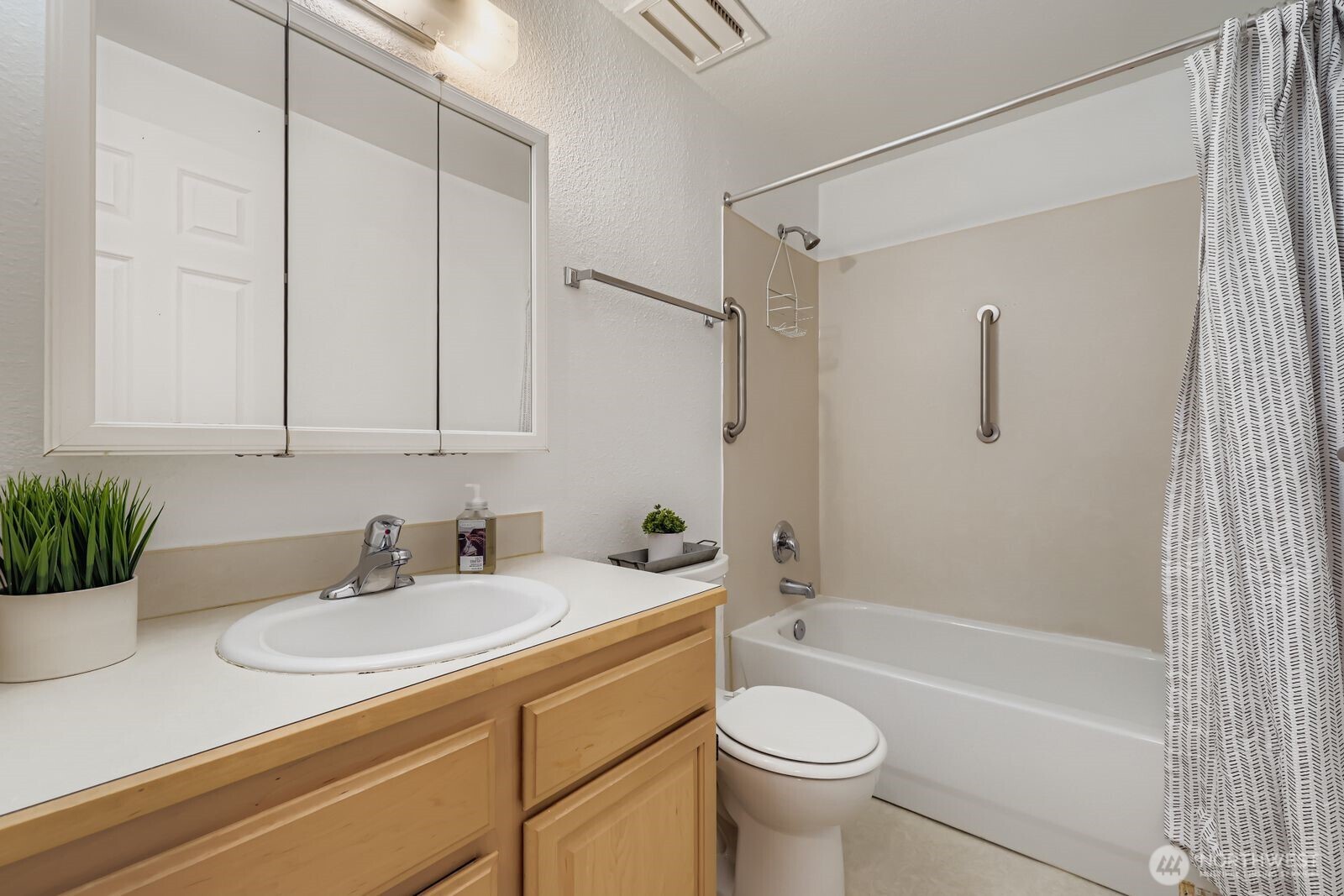 2120 Highland Avenue, Unit 104 Everett, WA 98201 - Photo 16 of 22 a bathroom with a sink a toilet and shower