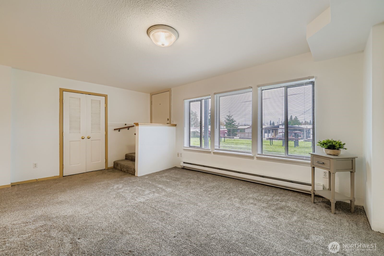 2120 Highland Avenue, Unit 104 Everett, WA 98201 - Photo 4 of 22 an empty room with windows