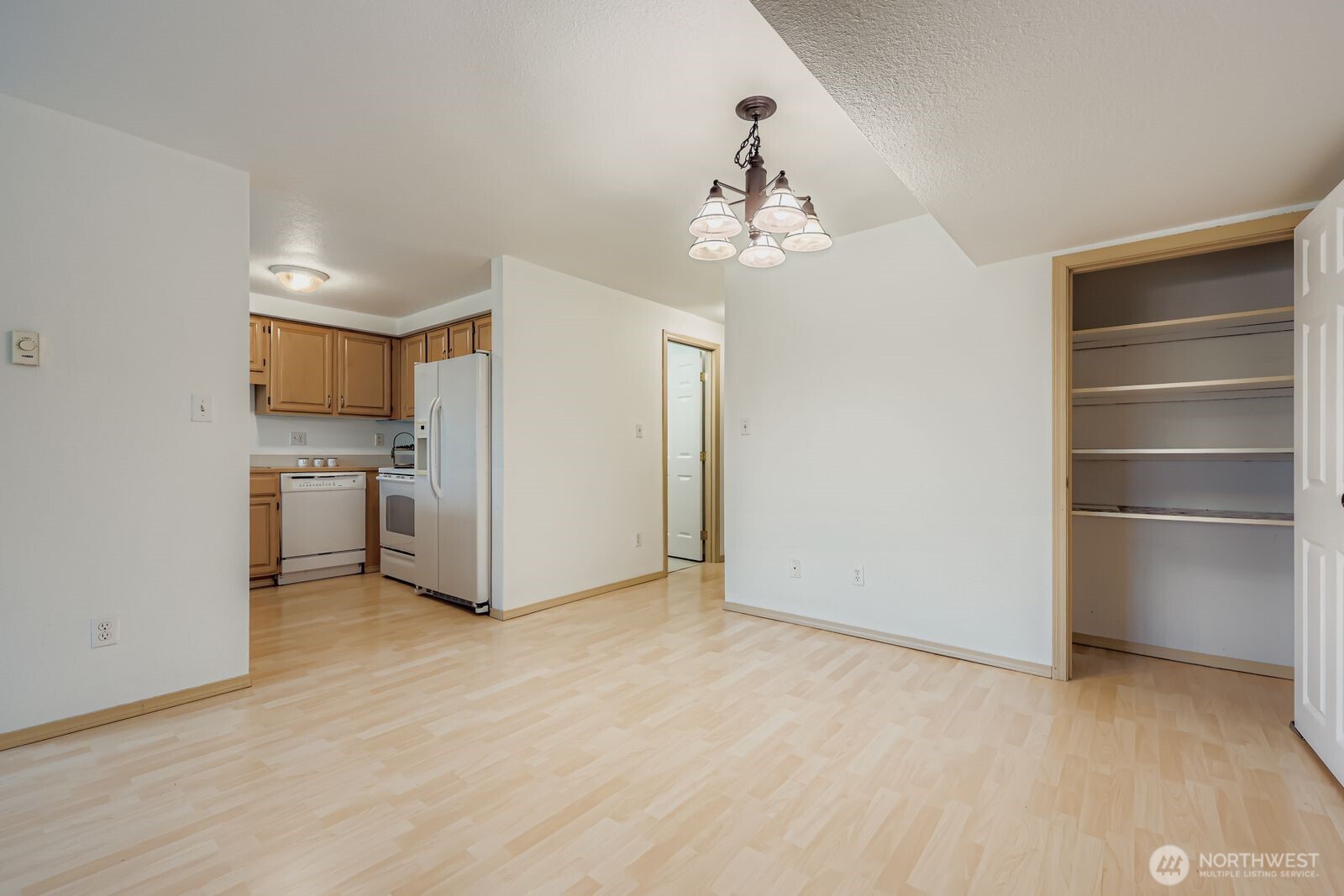 2120 Highland Avenue, Unit 104 Everett, WA 98201 - Photo 7 of 22 a view of a kitchen with a sink and a refrigerator